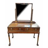 A REGENCY DESIGN EGYPTIAN REVIVAL LEATHER CLAD AND POLYCHROME MIRRORED BACK DRESSING TABLE With