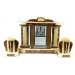 AN ART DECO MARBLE CLOCK GARNITURE SET Having brown and cream marble column supports, a square