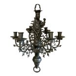 A 19TH CENTURY GOTHIC REVIVAL SIX BRANCH BRONZE CHANDELIER Mounted with a figure of Madonna and