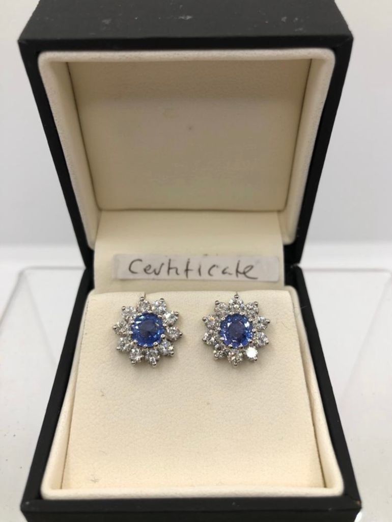 A PAIR OF 18CT WHITE GOLD, CORNFLOWER BLUE SAPPHIRE AND BRILLIANT CUT DIAMOND EARRINGS. (1.07ct G-