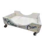 'LE CH TEAU CHIEN', A LARGE VINTAGE PAINTED AND DECORATED FOUR WHEEL TROLLEY. (w 149cm x h 63cm x