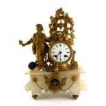 A LATE 19TH CENTURY FRENCH GILT METAL AND ALABASTER FIGURATIVE MANTEL CLOCK Surrounded by bronzed