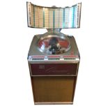 A STYLISH AMI CONTINENTAL II JUKEBOX, CIRCA 1960/62 Complete with records. (w 77cm x d 67cm x h