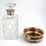 GARRARD AND CO., A VINTAGE SILVER AND CUT LEAD CRYSTAL GLASS DECANTER Having a hexagonal form