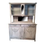 AN EARLY 20TH CENTURY CONTINENTAL DRESSER With open shelves and a mirrored back above drawers and