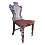 A VICTORIAN MAHOGANY HALL CHAIR With shield back and solid seat, on turned legs. (44cm x 46cm x