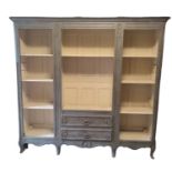 A LATE 19TH CENTURY CONTINENTAL OPEN BOOKSHELF With adjustable shelves and two central drawers, in a