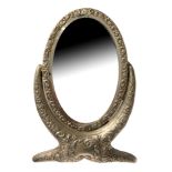AN EARLY 20TH CENTURY SILVER MINIATURE DRESSING TABLE MIRROR Having an oval bevelled glass mirror on