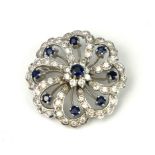 A VINTAGE 18CT WHITE GOLD, DIAMOND AND SAPPHIRE BROOCH The arrangement of round cut diamonds