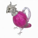A SMALL SILVER PLATED AND CRANBERRY GLASS 'PARROT 'CLARET JUG Having a hinged head with glass eyes
