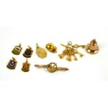 A COLLECTION OF VINTAGE 9CT GOLD CHARMS To include four enamel armorial charms 'Guernsey', '