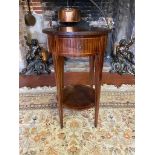 AN EARLY 20TH CENTURY FRENCH MAHOGANY TWO TIER OCCASIONAL TABLE With a segmented circular top and