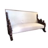 A 19TH CENTURY ITALIAN CALICO UPHOLSTERED SETTEE The mahogany frame carved with acanthus leaves