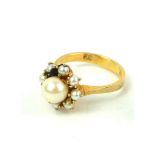 AN EARLY 20TH CENTURY 9CT GOLD AND PEARL CLUSTER RING Having an arrangement of pearls forming a