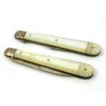 A VICTORIAN SILVER AND MOTHER OF PEARL FRUIT KNIFE AND FORK SET Having a folding mechanism and