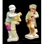 TWO 19TH CENTURY GERMAN KPM/BERLIN PORCELAIN FIGURINES To include a young gent wearing a fur hat