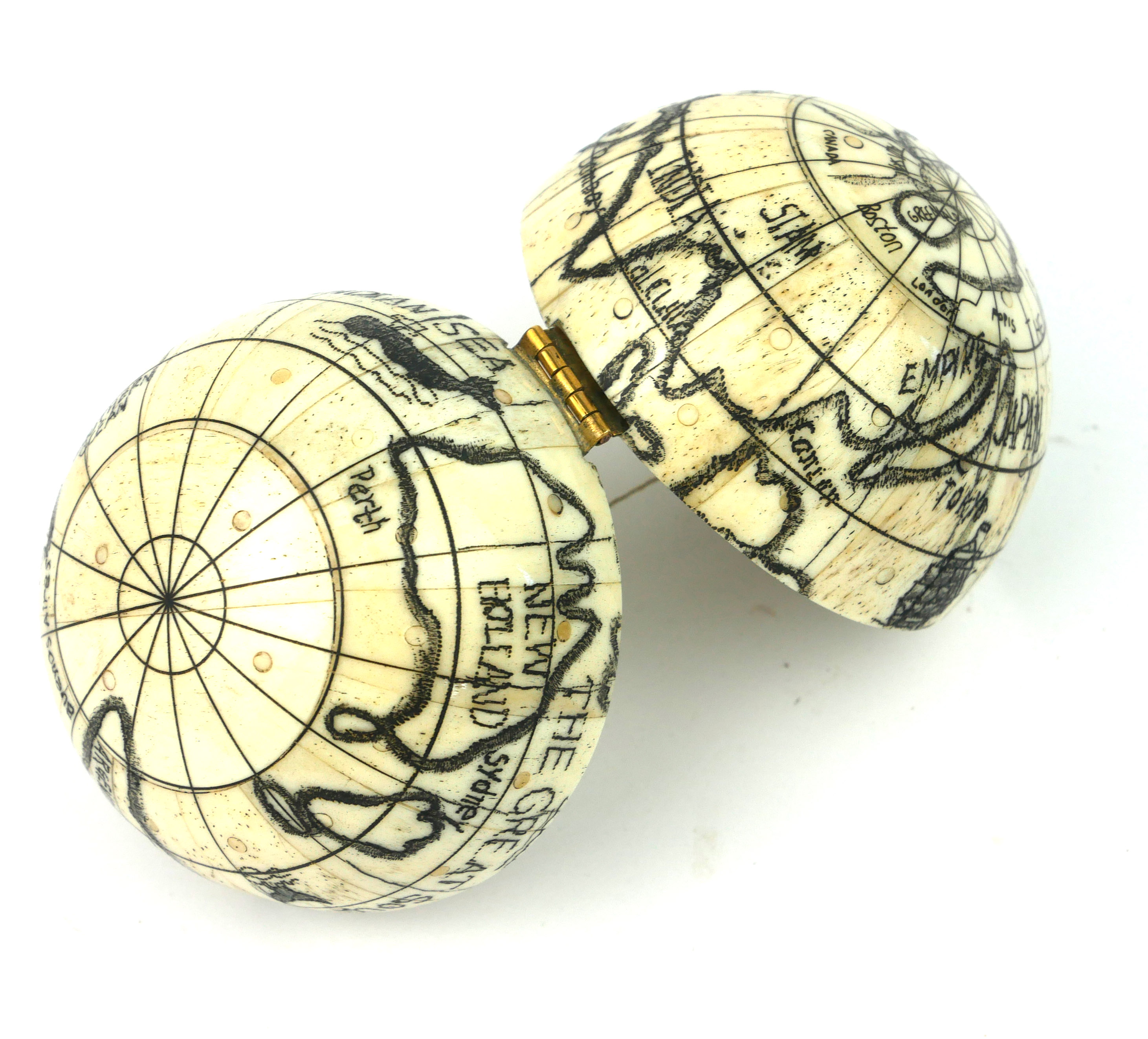 A 20TH CENTURY CARVED BONE SPHERICAL POCKET GLOBE COMPASS With black ink decoration and a glazed - Image 3 of 3