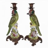 A PAIR OF DECORATIVE 20TH CENTURY PORCELAIN MODEL OF EXOTIC GREEN GLAZED PARROTS MODELLED AS TABLE