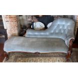 A VICTORIAN MAHOGANY CHAISE LOUNGE The single spoon back above an acanthus carved scrolling arm,