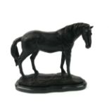 A 20TH CENTURY BRONZE MODEL OF A STANDING RACEHORSE Raised on black marble oval base. (h 22cm)