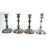 A SET OF FOUR VICTORIAN SILVER CANDLESTICKS, of Georgian knopped design having circular sconces