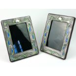 A PAIR OF SILVER AND ENAMEL ART NOUVEAU DESIGN PHOTOGRAPH FRAMES Having organic forms with blue