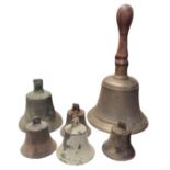 AN EDWARDIAN BRONZE SCHOOL BELL Along with a butlers bell and three others. (largest 32cm)