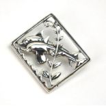 AN ART DECO DESIGN DANISH SILVER RECTANGULAR BROOCH With pierced decoration of dolphins, marked '