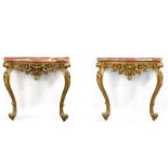 A PAIR OF 18TH CENTURY GILTWOOD CONSOLE TABLES In Neapolitan style, the later rouge marble tops