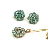 AN EARLY 20TH CENTURY 9CT GOLD AND BLUE ZIRCON PENDANT NECKLACE AND EARRINGS