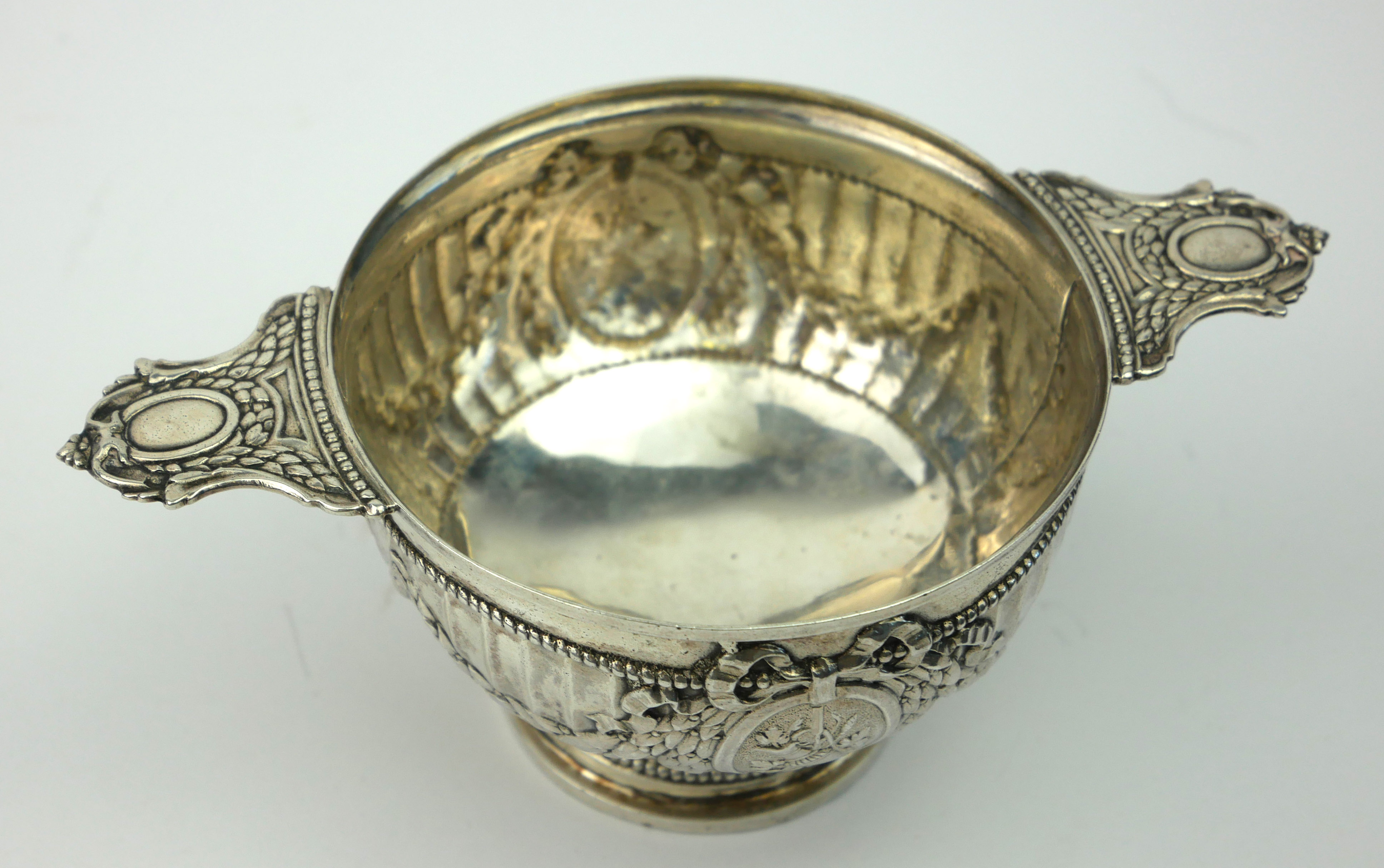 A 19TH CENTURY FRENCH SILVER QUAICH/PORRINGER Having twin handles, the fluted body with embossed - Image 2 of 3