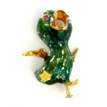 A YELLOW METAL, ENAMEL AND RUBY 'COMICAL DUCK' BROOCH Animated pose, with ruby set eyes and green