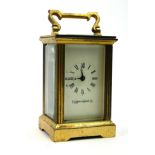 MAPPIN AND WEBB, A 20TH CENTURY GILT BRASS MINIATURE CARRIAGE CLOCK Having a single carry handle and