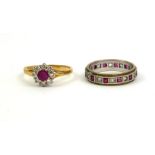 A VINTAGE 18CT GOLD, RUBY AND DIAMOND RING The single round cut ruby edged with diamonds forming a