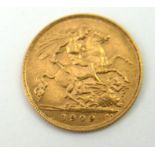 AN EDWARDIAN 22CT GOLD HALF SOVEREIGN COIN, DATED 1909 With King George and Dragon verso.