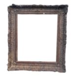 A LARGE 19TH CENTURY ENGLISH CARVED GILTWOOD AND GESSO PICTURE FRAME. (rebate 64.5cm x 76.5cm,