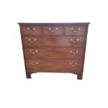 A GEORGIAN MAHOGANY CHEST Of three short above above three long drawers fitted with brass swan