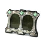 A SILVER AND ENAMEL ART NOUVEAU DESIGN DOUBLE PHOTOGRAPH FRAME Having three organic form motifs,