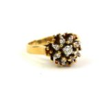 STARLIGHT, AN 18CT GOLD AND DIAMOND CLUSTER RING Having an arrangement of round cut diamonds (size