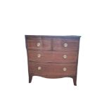 AN EARLY VICTORIAN MAHOGANY BOW FRONTED CHEST With two short above two long drawers fitted with