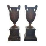 A PAIR OF VICTORIAN EGYPTIAN REVIVAL BRONZE VASES On black marble bases. (38cm) Condition: good