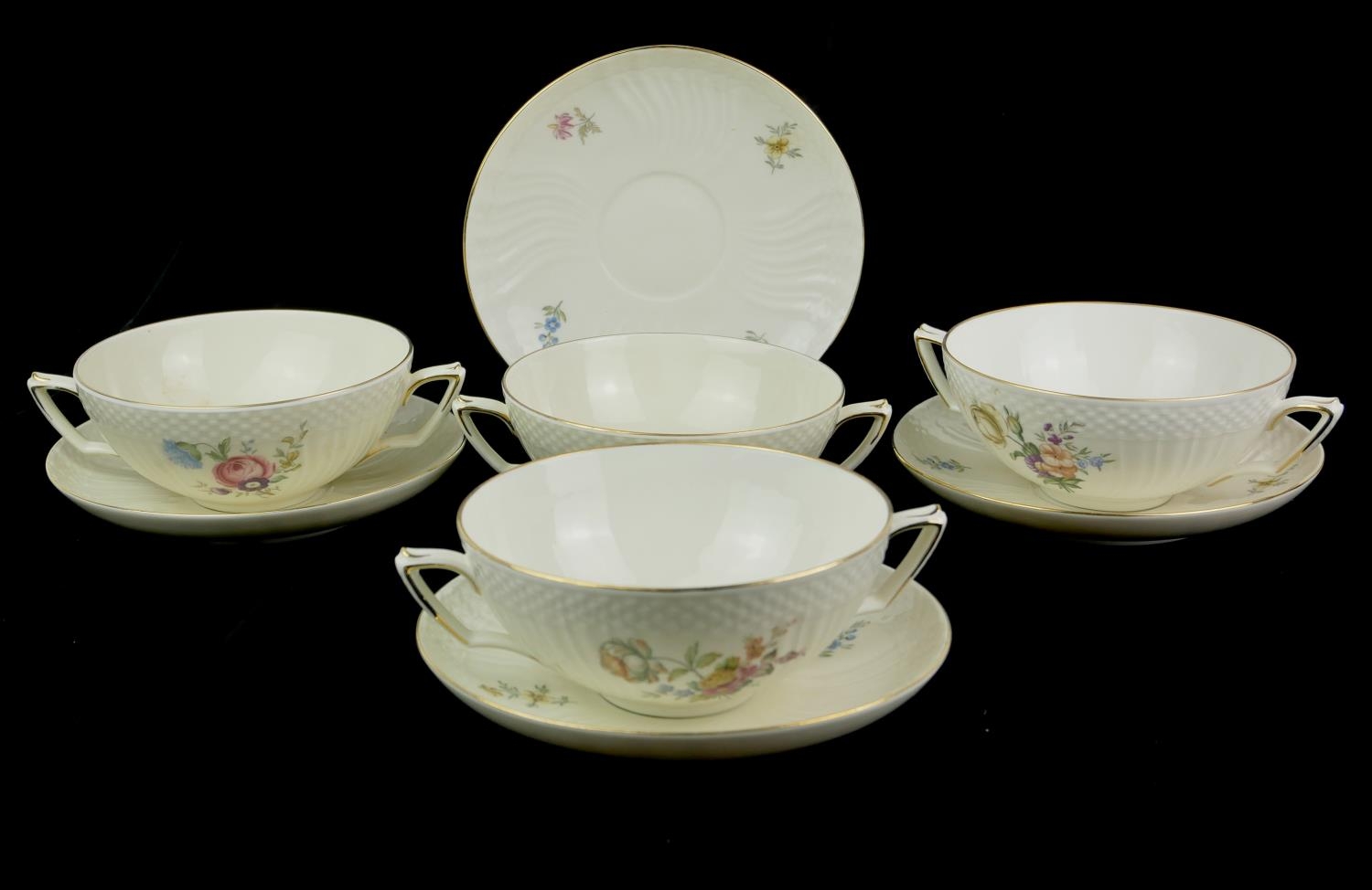 ROYAL COPENHAGEN, A SET OF FOUR VINTAGE DANISH PORCELAIN SOUP BOWLS Having twin handles and floral