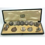 A SET OF SIX SILVER ART NOUVEAU BUTTONS Each set with a portrait of a maiden with flowers, in a