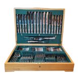 AN OAK CASED FINE SHEFFIELD SILVER PLATED AND STAINLESS STEEL CUTLERY SET FOR EIGHT Comprising