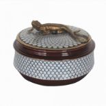 A 20TH CENTURY PORCELAIN CIRCULAR BOX AND COVER Mounted with a bronze lizard.
