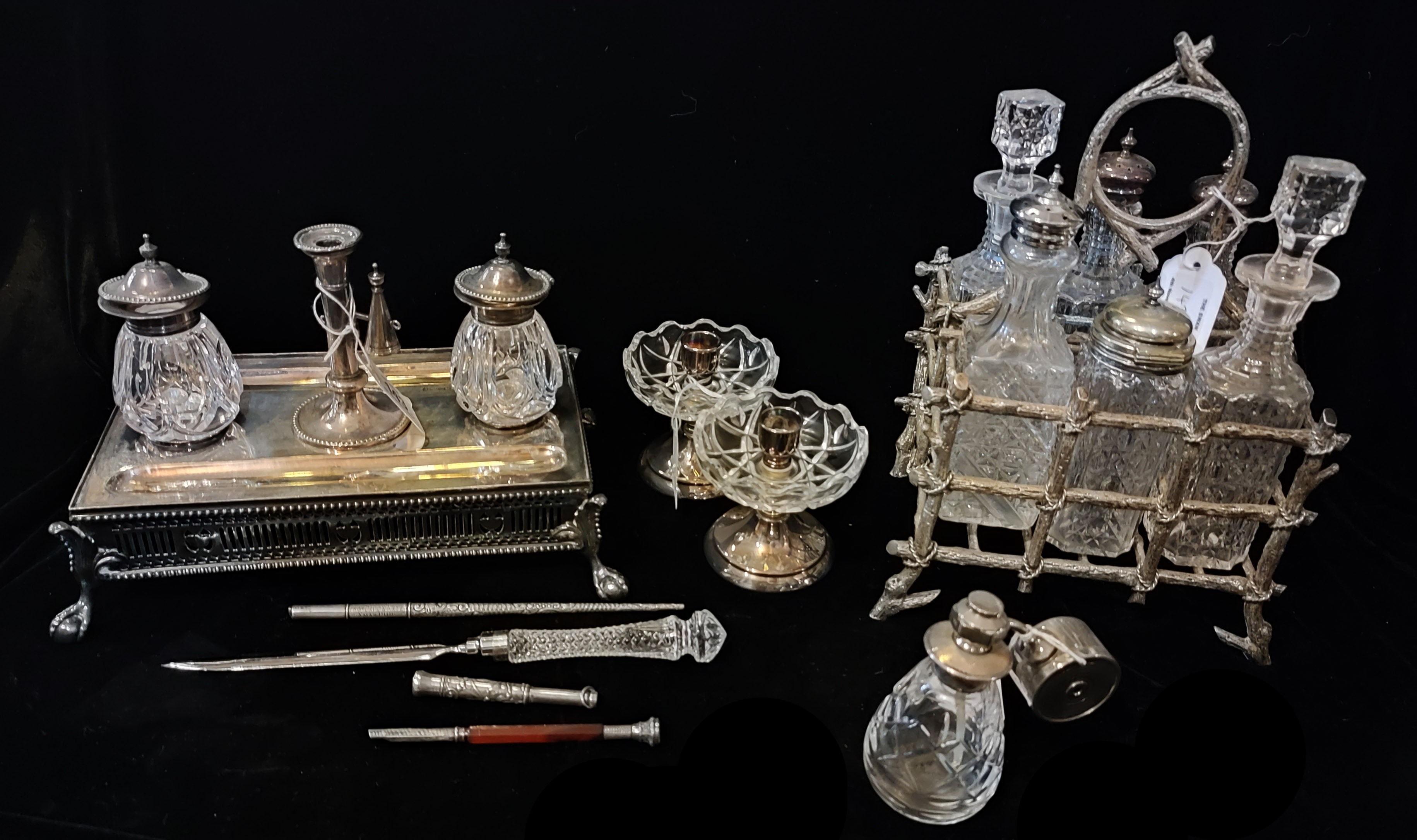 AN EARLY 20TH CENTURY SILVER PLATE AND CUT GLASS RECTANGULAR INKSTAND With taper candlestick and a