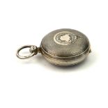 A VICTORIAN SILVER SPHERICAL SOVEREIGN CASE With engine turned decoration and spring loaded