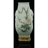 A 20TH CENTURY CHINESE CELADON GLAZED PORCELAIN VASE Having twin elephant mask handles and floral