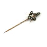 A VICTORIAN 18CT GOLD AND DIAMOND MASONIC STICK PIN Having a square and compass design set with