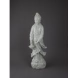 An elegant Dehua figure of Guanyin, 19th century - - H46cm L15.5cm - - standing in flowing robes